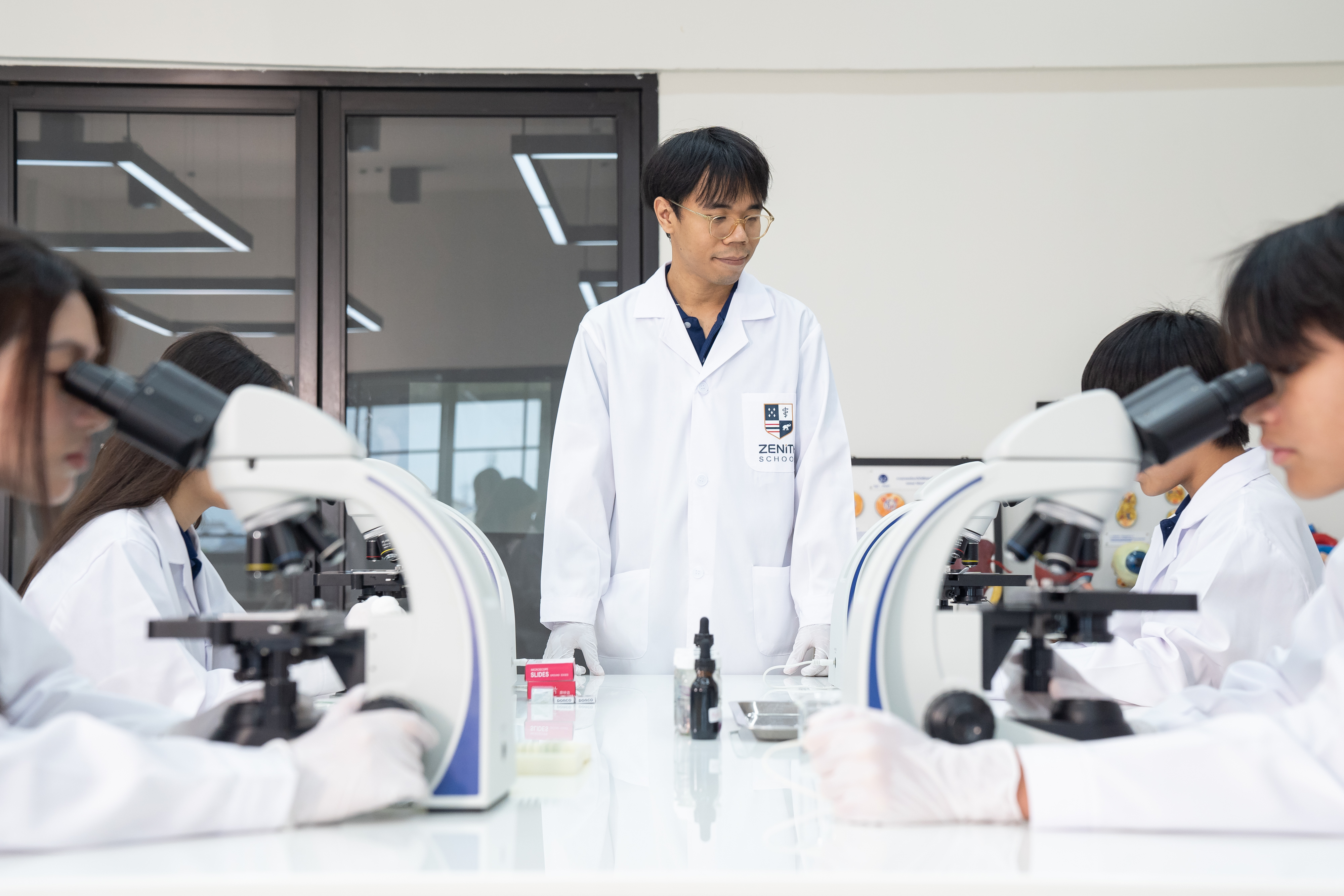 Teachers and students in a pre-med classroom at Zenith School